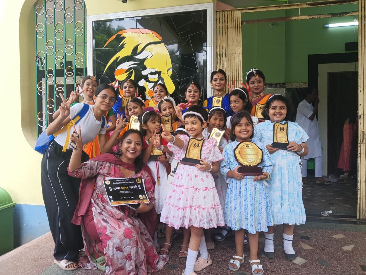 Young students with award trophies